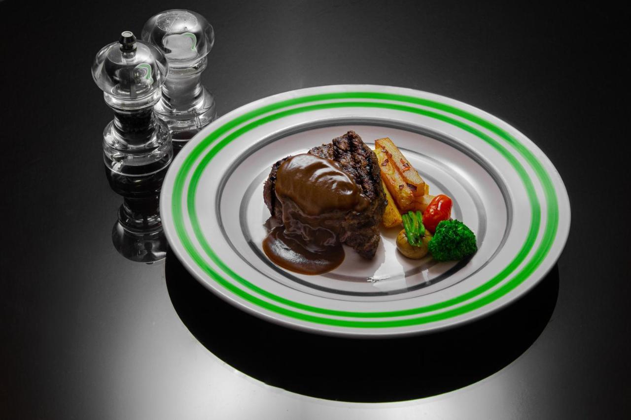 Oryx Hotel Akaba Kültér fotó A steak prepared with a steak sauce